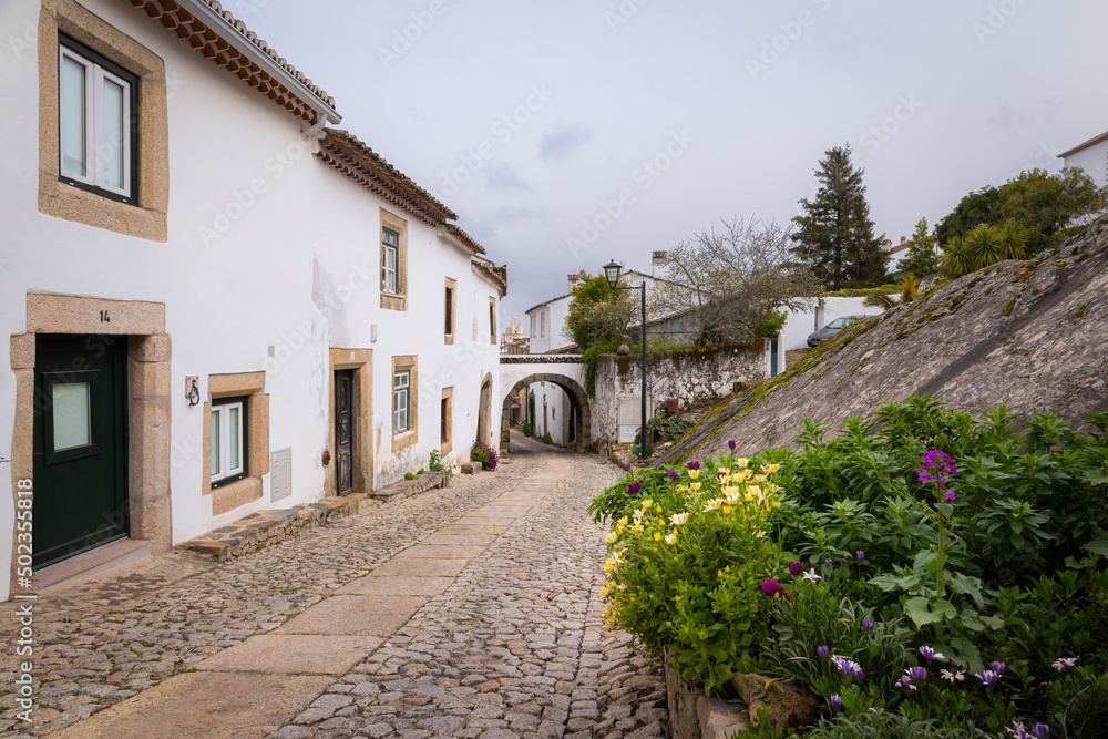 Street with traditional white houses in medieval village Marvao (Portugal, Alentejo)