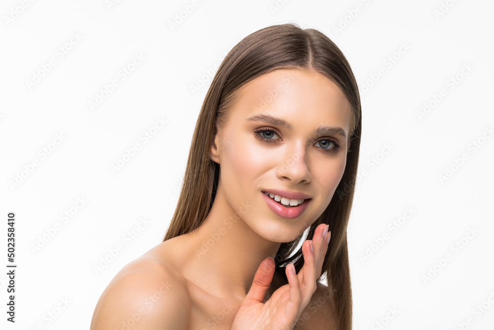 Portrait of a laughing beautiful half naked woman applying face cream and looking away isolated over white background Portrait of a laughing beautiful half naked woman applying face cream and looking away isolated over white background