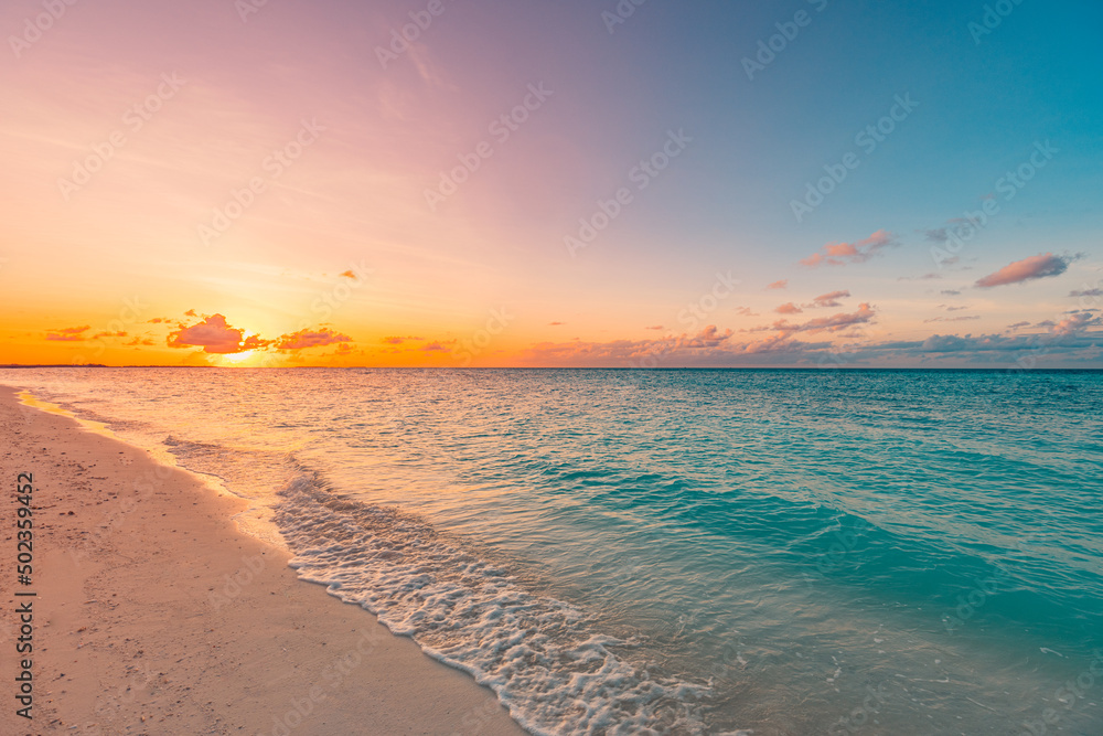 Closeup sea sand beach. Panoramic beach landscape. Inspire tropical beach seascape horizon. Orange and golden sunset sky calmness tranquil relaxing sunlight summer mood. Vacation travel holiday banner