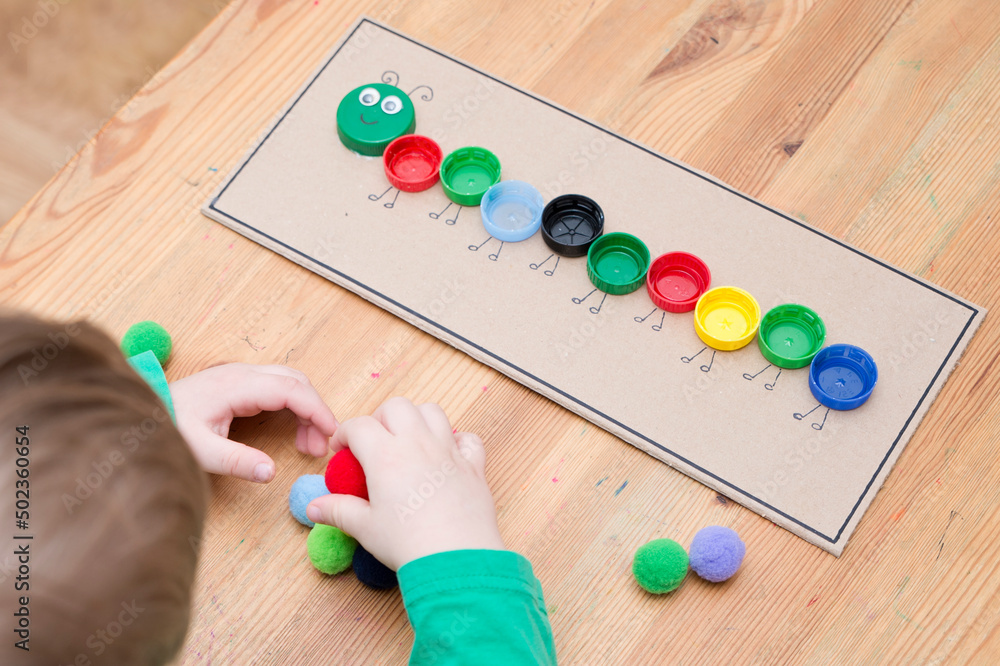 Plastic bottle caps worm. Put correct color pom poms in centipede ...
