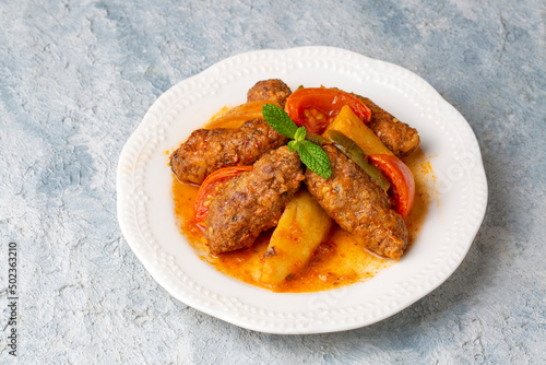 Traditional Homemade Turkish Food Kofte - Kofta with Tomato Sauce and Potatoes. (Turkish name; Izmir kofte) photo