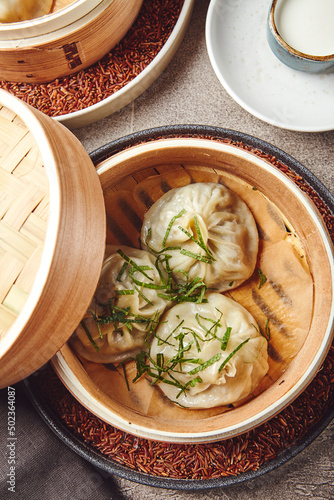 Traditional Asian national food Manti, Manta or Manty, like dumplings in bamboo steamer