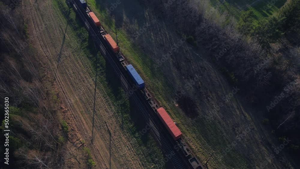 Shipping containers transportation on freight train by railway. Cargo