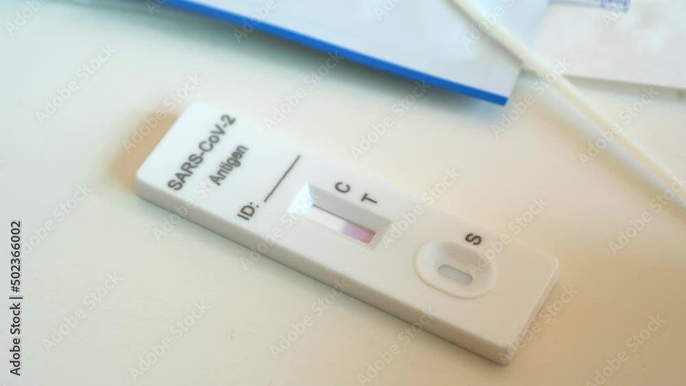 Just used rapid coronavirus atk test without stripes, waiting for result. Fast antigen covid-19 test kit for self diagnosis after using on white table at home pending of results. Pandemic concept. Just used rapid coronavirus atk test without stripes, waiting for result. Fast antigen covid-19 test kit for self diagnosis after using on white table at home pending of results. Pandemic concept.
