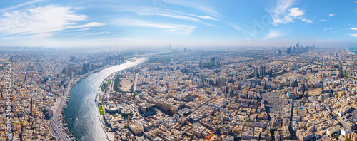 Panoramic aerial view of Dubai Creek and city skyline, Dubai, United Arab Emirates. photo