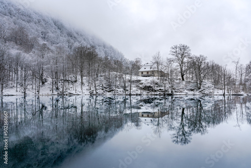 Mountain refuge at the Lac de Bethmale during winter in Ariege, France © Simon