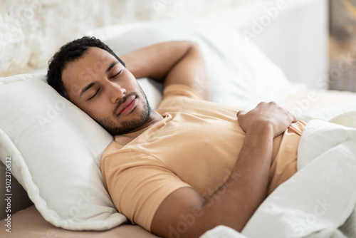 Middle Eastern Man Sleeping Lying On Pillow In Bed Indoor