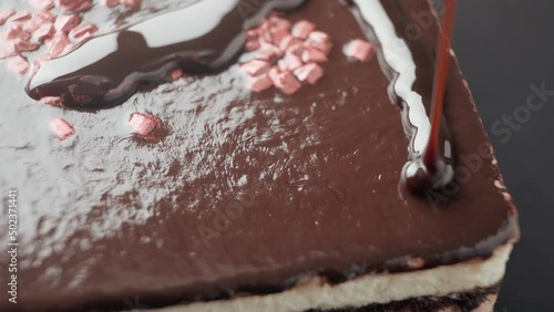 The cake is covered with chocolate topping