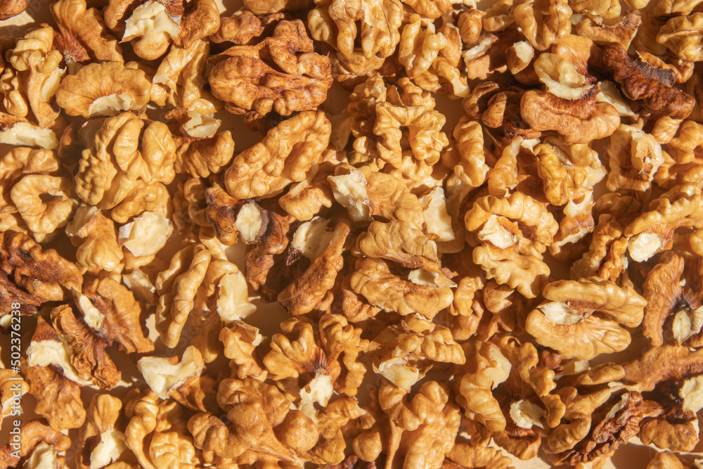 Peeled walnuts top view. Food abstract background with nuts Peeled walnuts top view. Food abstract background with nuts