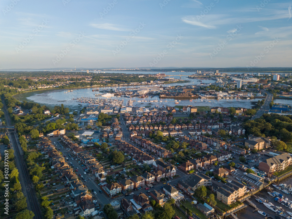 Aerial view of the River Itchen over St Denys with moored boats at sunset, Southampton, United Kingdom. Aerial view of the River Itchen over St Denys with moored boats at sunset, Southampton, United Kingdom.