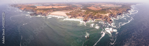 Panoramic aerial view of beautiful coastline with high cliffs along the Atlantic Ocean in Odeceixe, Faro district, Alentejo region, Portugal. photo
