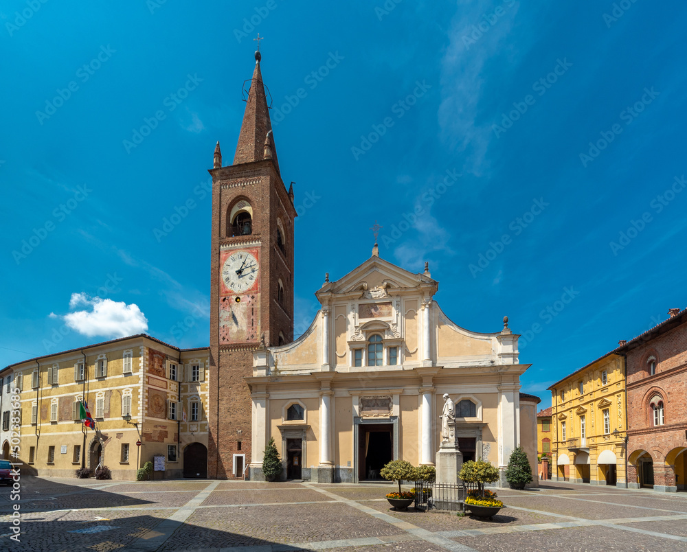 Bene Vagienna, Cuneo, Italy - May 02, 2022: Parish church of Maria Vergine Assunta with bell tower near the Town Hall and historic medieval palaces in Botero square