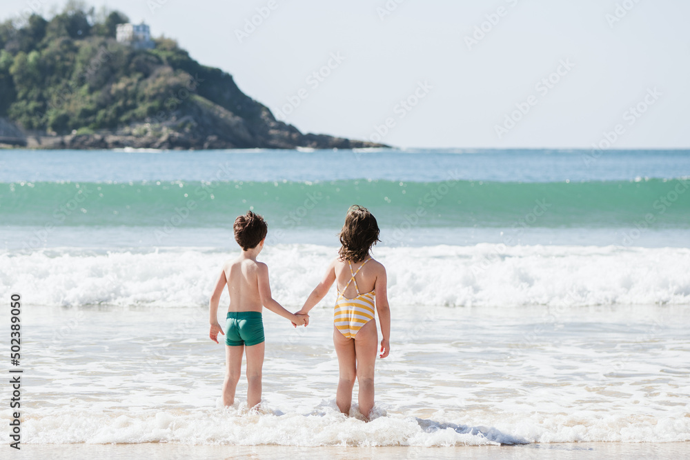 Anonymous children on wet coast Anonymous children on wet coast