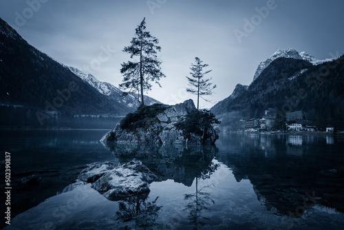 Grayscale shot of the Hintersee, Mountain Lake, Stones in Water, Bavaria, Germany