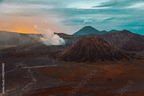 Bromo Tengger Semeru National Park in Indonesia, with calderas, mountains, and a colorful sky photo