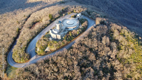 Aerial shot of a building located on a top of the Brasstown bald mountain  during the day photo