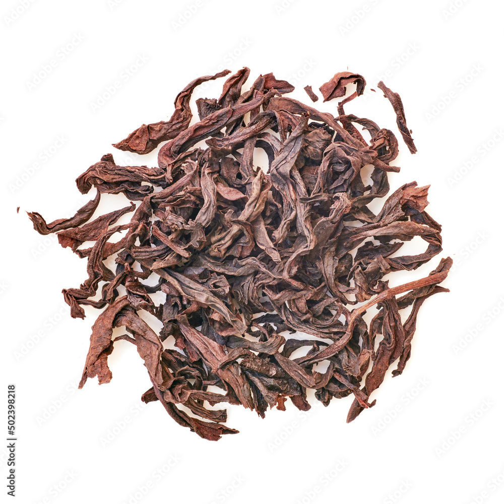 Obraz premium Chinese brown tea dry leaves macro, view from above, isolated,round shape pile