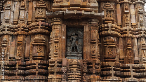 Vertical shot of a sculpture carved on the Ananta Vasudev Temple in India photo