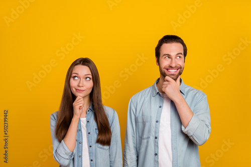 Photo of smart millennial brown hairdo couple look promo wear jeans shirts isolated on yellow background