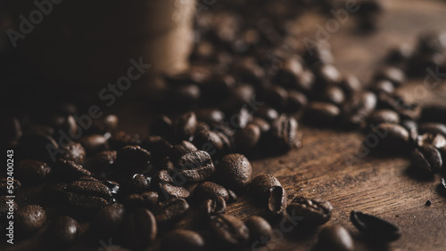 Canvastavla Close-up shot of a heap of coffee beans on wooden surface