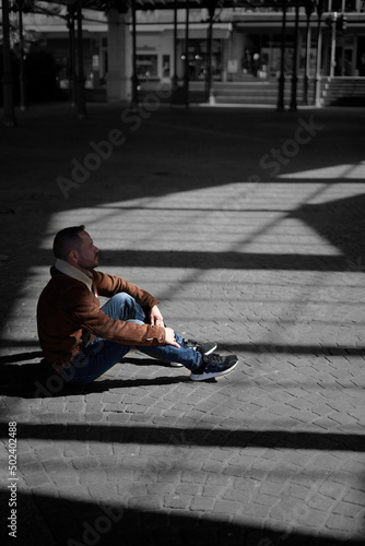 Fototapeta Naklejka Na Ścianę i Meble -  sad man alone in the street