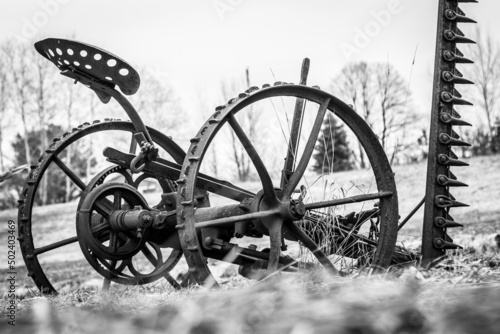 Obraz na plátně Grayscale shot of an old farm equipment