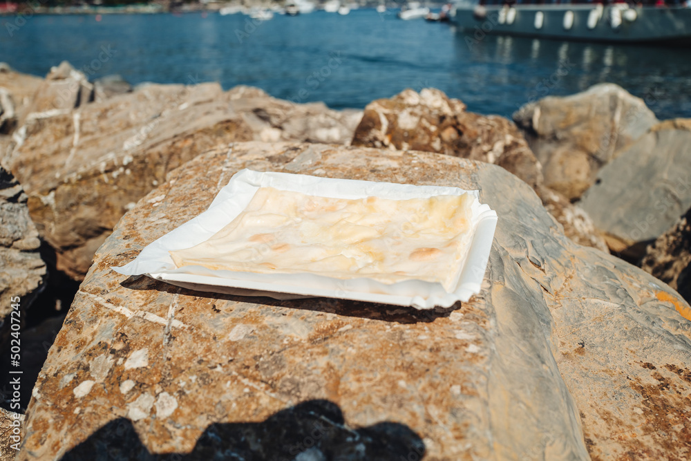 Eating Focaccia di Recco in Liguria region Eating Focaccia di Recco in Liguria region