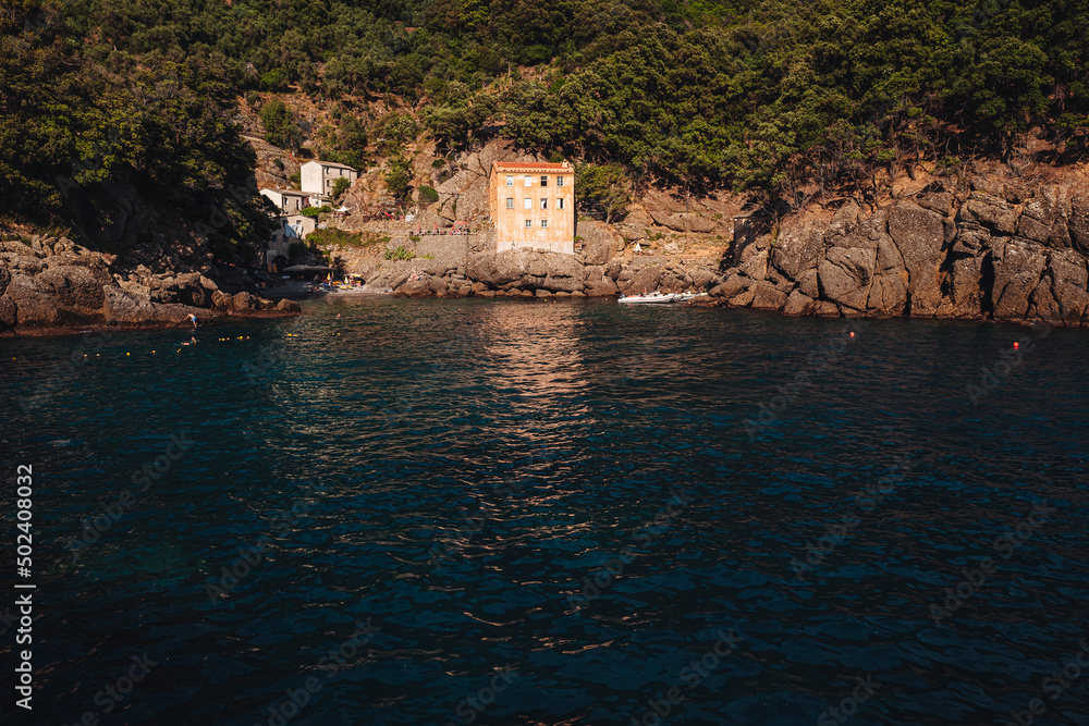 SAN FRUTTUOSO, ITALY - JULY 2021: The ancient monastery on the coastline of Liguria region. near Portofino