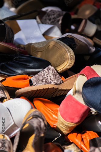 shoes piled up in flea market