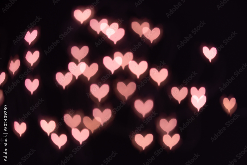 bokeh pink hearts background, blurred hearts on dark background, bokeh effect from camera lens bokeh pink hearts background, blurred hearts on dark background, bokeh effect from camera lens