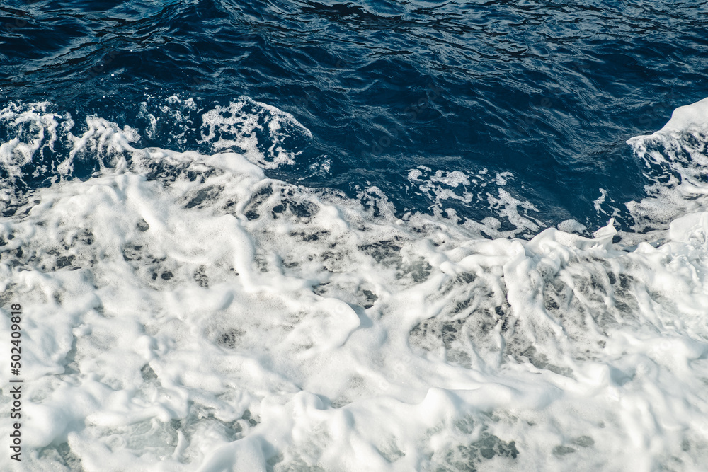 Crashing waves foam in the mediterranean sea