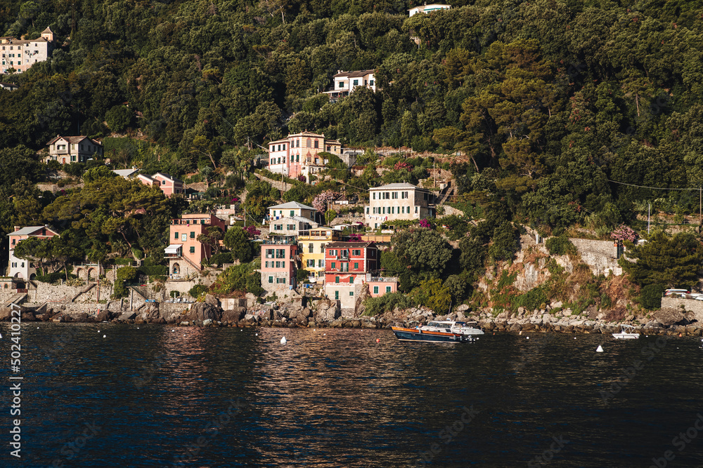 Porto Pidocchio, italy - July 2021: A small old wharf on the coastline of Liguria