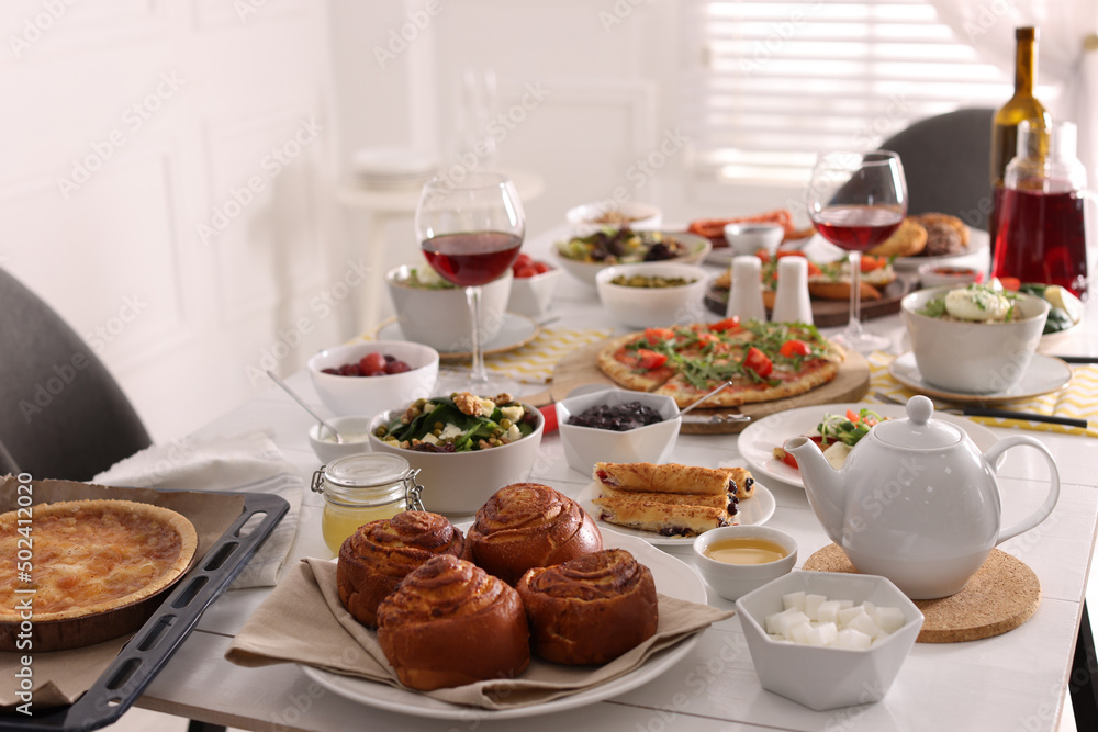 Many different dishes served on buffet table for brunch Many different dishes served on buffet table for brunch