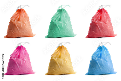 Set with different trash bags full of garbage on white background