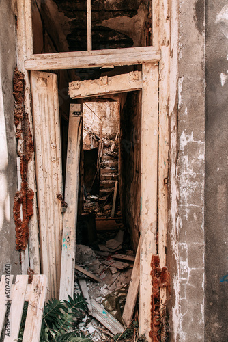 Vertical shot of the entry of an abandoned building in Crete photo