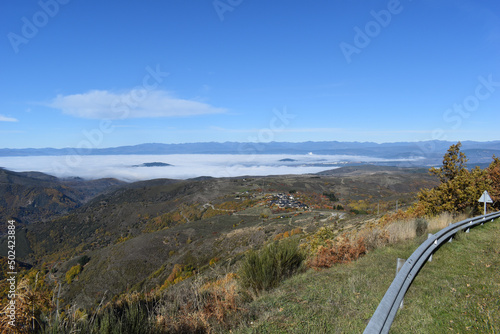 Scenery of Ponferrada (El Bierzo) from Bouzas road on a sunny, foggy day in Spain photo