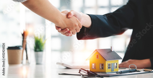 Real estate agent or realtor handshake with her client after the deal, .business people. handshake Successful business concept.