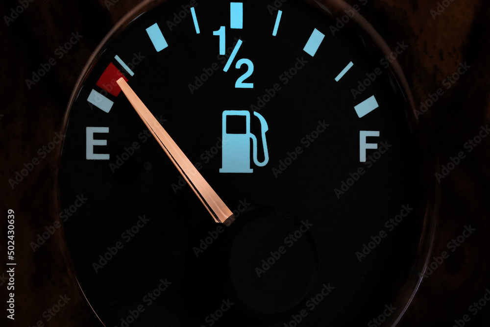 Naklejka premium fuel gauge in car dashboard in illuminated night mode - empty