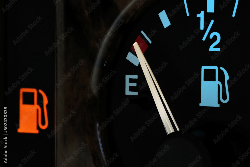 Naklejka premium fuel gauge in car dashboard in illuminated night mode - empty