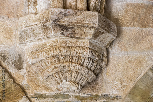 Romanesque corbels in medieval chapterhouse of the Monastery of Saint Mary of Carracedo, Spain photo