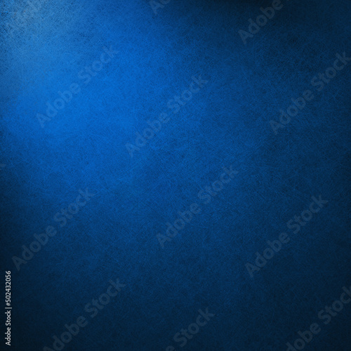 Elegant blue and black background with texture, dark blue wall with spotlight shining and black vignette border design, luxury sapphire or royal blue color