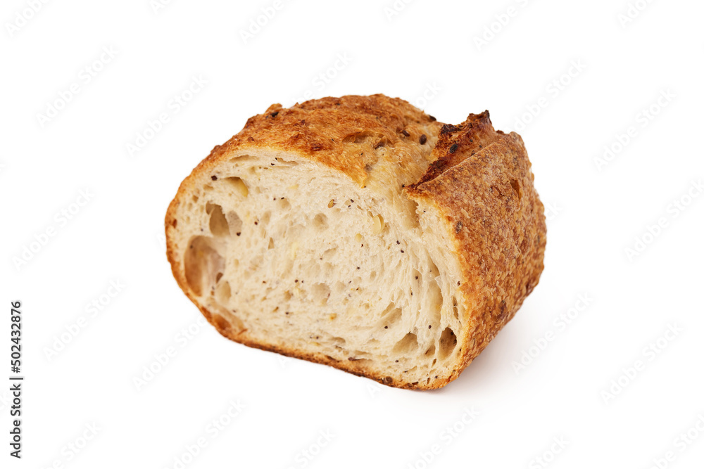 Closeup slice of fresh baked french baguette bread isolated at white background.