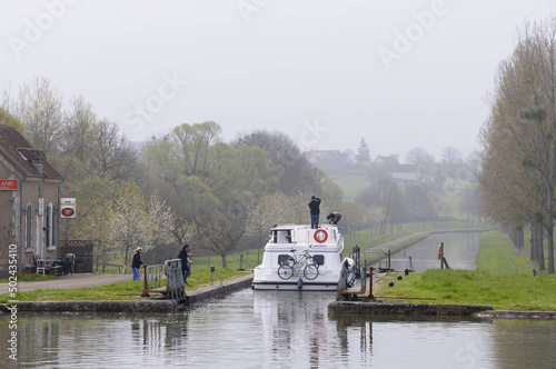 Ship in the canal. Le Brioux, Achun, Nievre, Burgundy, France. photo