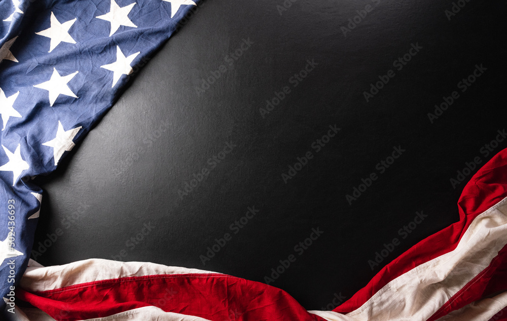 Fototapeta premium Happy memorial day concept made from American flag on dark wooden background.