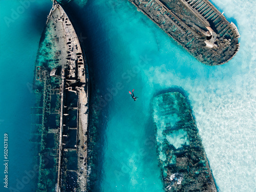 Drone view of the Tangalooma Wrecks in the sea in Moreton Island, Australia photo