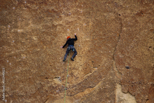 View of a climber on a Monkey Face at Smith Rock State Park, Oregon photo