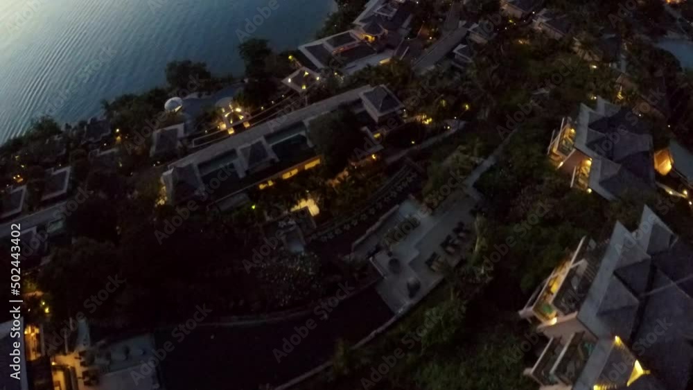 Aerial Forward Shot Of Illuminated Hotels On Island At Dusk - Bangkok, Thailand Aerial Forward Shot Of Illuminated Hotels On Island At Dusk - Bangkok, Thailand