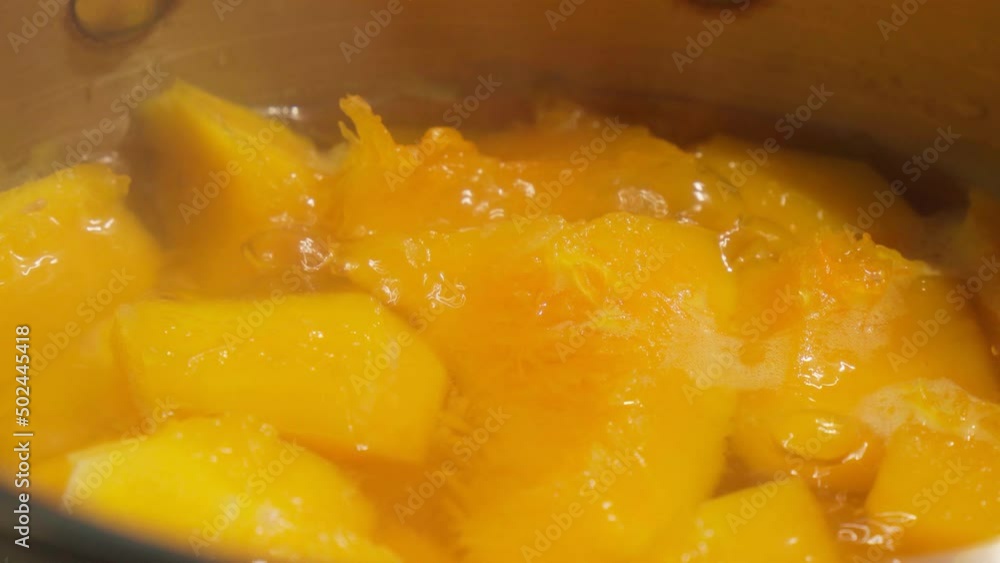 Chopped pumpkin pieces in a saucepan top view. healthy food concept. Selective focus Chopped pumpkin pieces in a saucepan top view. healthy food concept. Selective focus