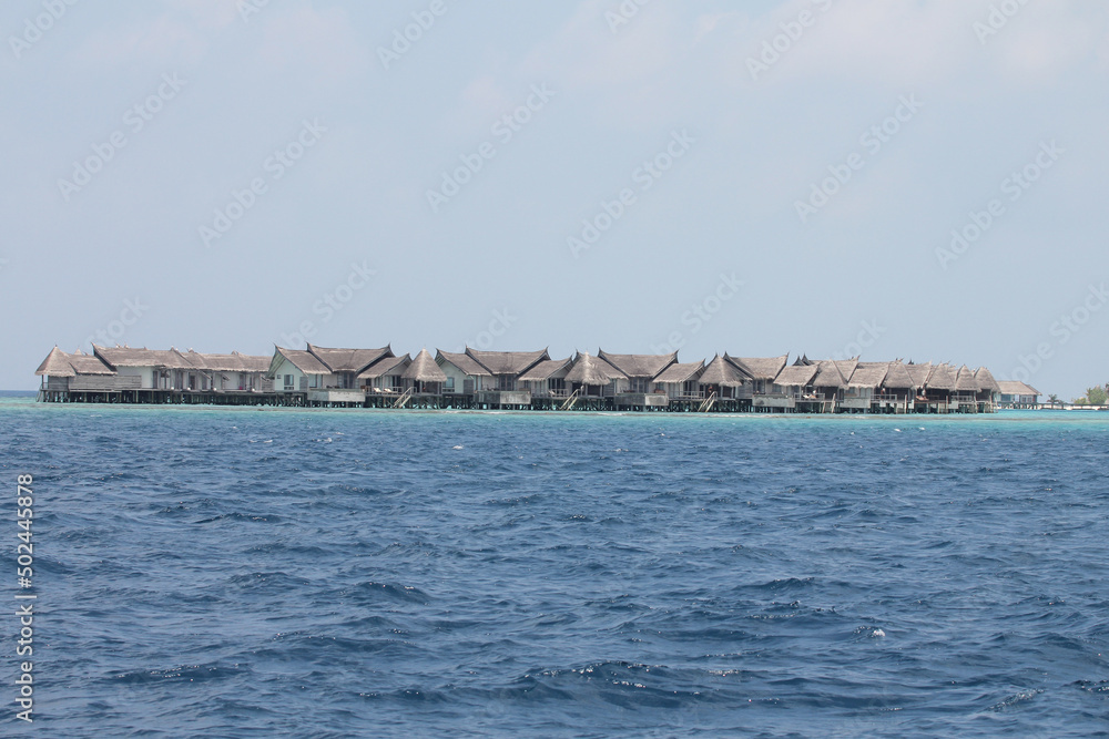 Maldives. Indian Ocean. Bungalow hotel on the water.