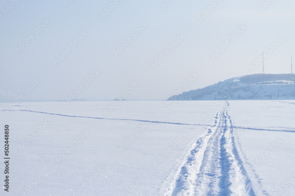 Snowmobile track marks on the snow